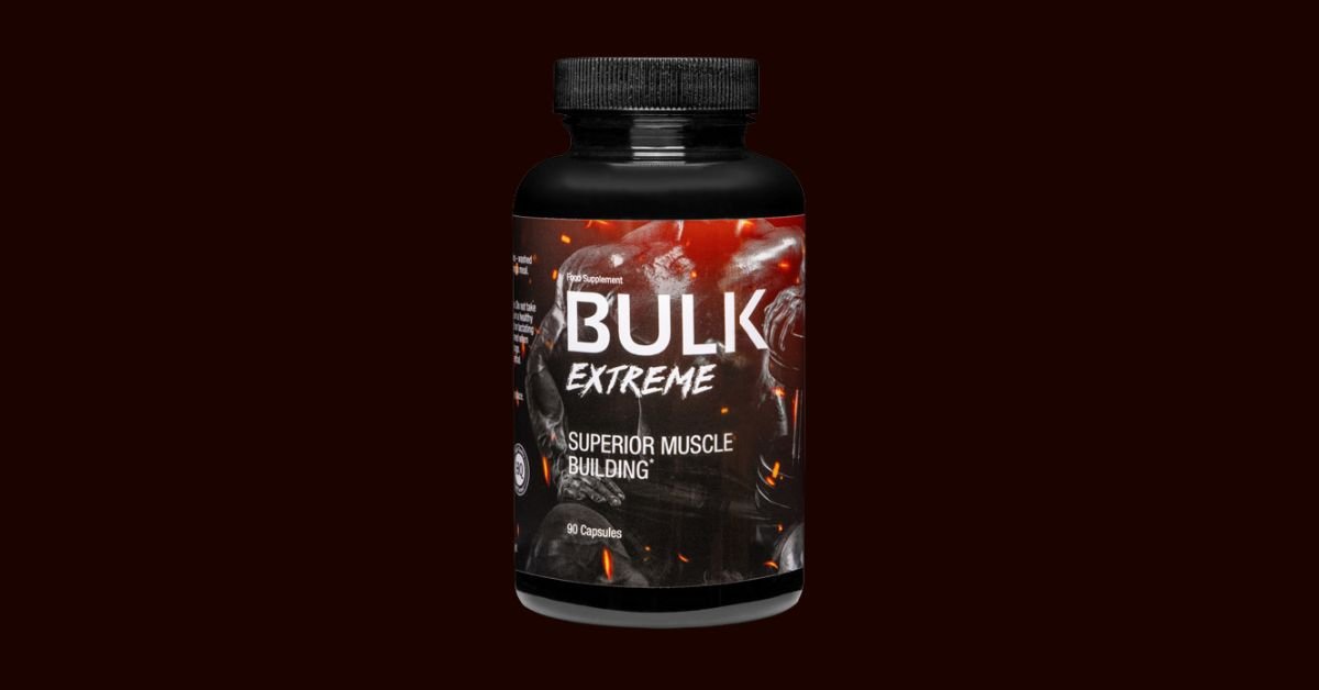 A bottle of Bulk Extreme muscle-building supplement placed on a gym floor with dumbbells in the backgroun