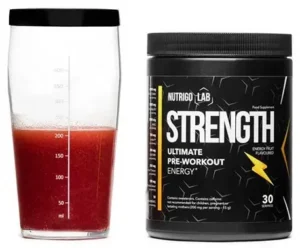 A container of Nutrigo Lab Strength pre-workout supplement with a measuring scoop beside it, highlighting its purpose of enhancing strength and endurance for better workout performance.